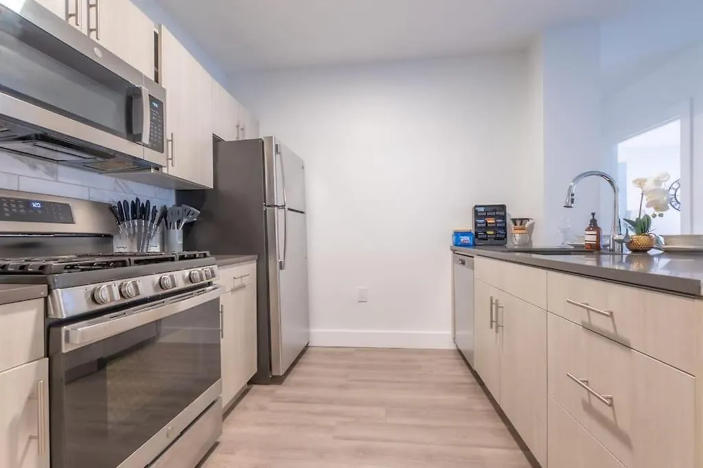 Spacious Airport Suite: Two-Bedroom Comfort with Laundry Orange