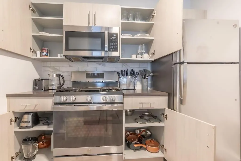 Spacious Airport Suite: Two-Bedroom Comfort with Laundry Orange